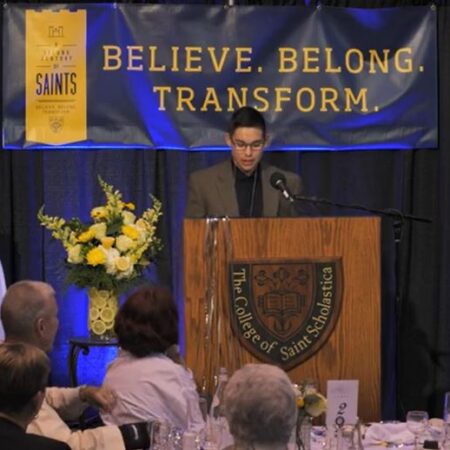 Carter Nguyen speaking about Impact at the Celebration Dinner