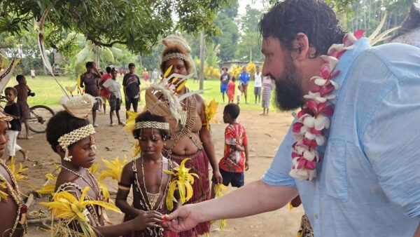 Kory Gilderman interacting with children in Papua, New Guinea