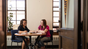 St. Scholastica student works with a mentor in her office.