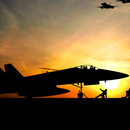Photo of planes taking off at sunset. A vision of a possible future for Aerospace Leadership Studies students.