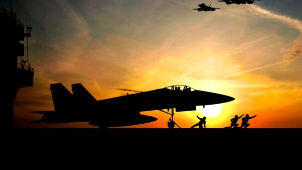 Photo of planes taking off at sunset. A vision of a possible future for Aerospace Leadership Studies students.