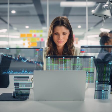 Woman working on Applied Artificial Intelligence on a computer