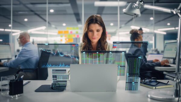 Woman working on Applied Artificial Intelligence on a computer