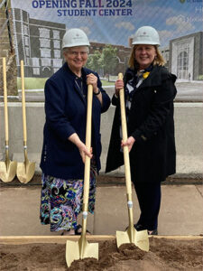 Dr. McDonald and Sister Beverly pose together with shovels at the Student Center groundbreaking.