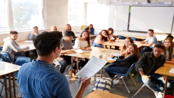 A St. Scholastica College in the schools (CITS) teacher in a classroom with their students.