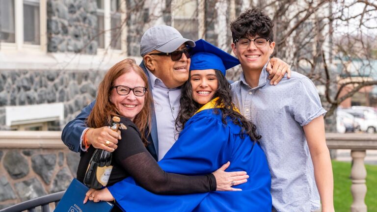 St. Scholastica graduate celebrates with her family.