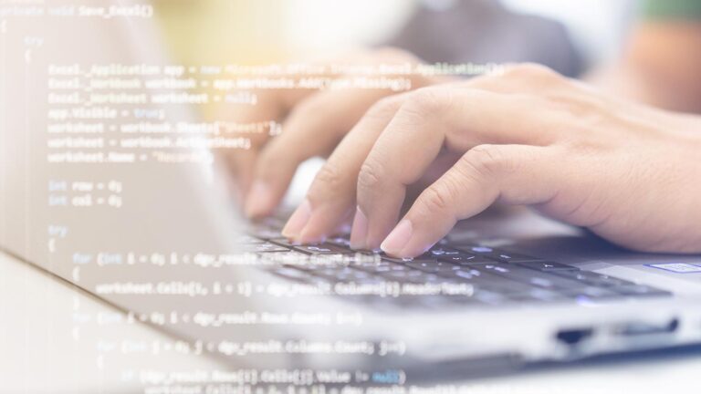 A photo of a person's hands on a laptop with an overlay of coding text.