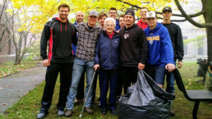 Photo of Sister Mary Josephine with the baseball team during an on campus landscaping project.