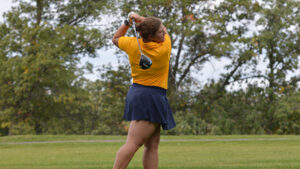 Senior Olivia Hanson playing golf