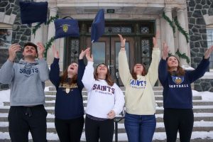 CSS students throwing their packable blankets in the aire