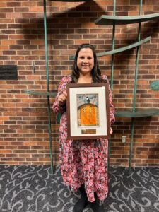 Gabriella (Herrera) Caldecott ’13 with the 2023 First-Generation Alumni Award at the Tri Alpha induction ceremony.