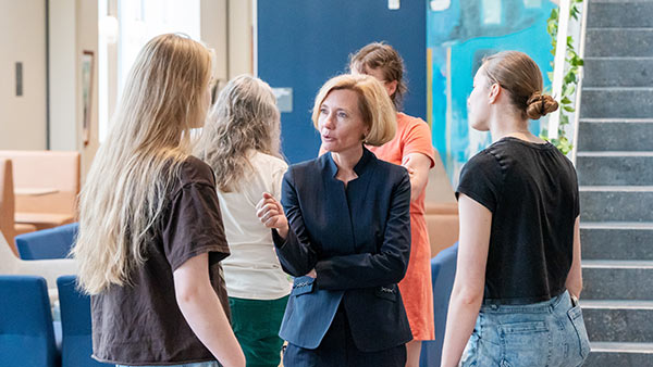 Dr. Brenda Kelly chats with St. Scholastica students at her welcome ceremony.