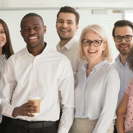 Group of professional leaders standing in a conference room.