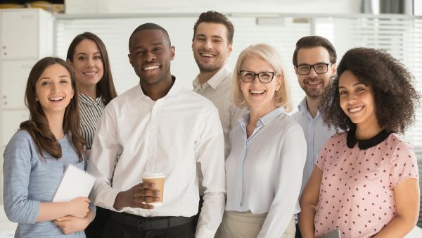 Group of professional leaders standing in a conference room.