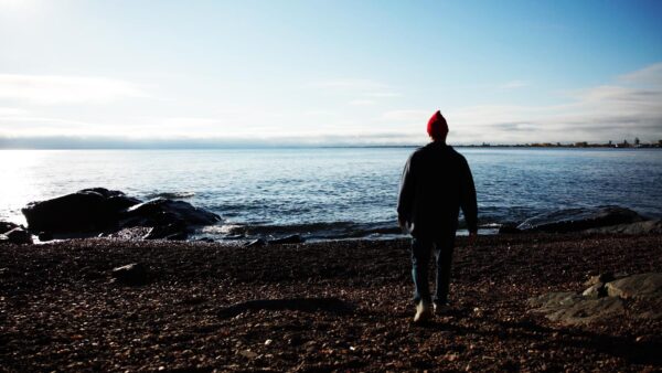Photo of Ryan Vine on a Lake Superior beach.