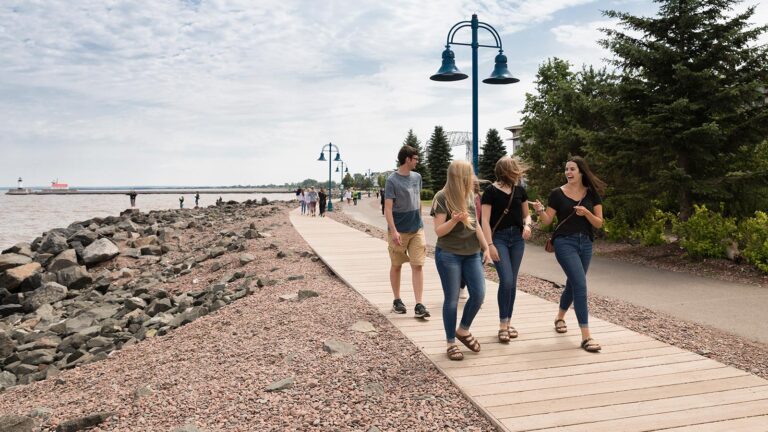 St. Scholastica students walking together through Canal Park in Duluth.