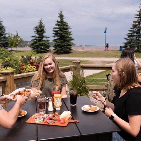 St. Scholastica students eating together in Canal Park.