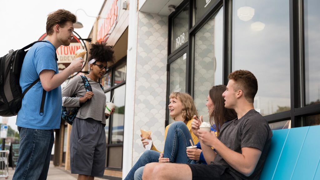 St. Scholastica students eating ice cream outside a Duluth ice cream shop.