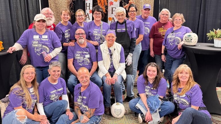 Photo of a group of volunteers for the St. Scholastica Thanksgiving Day Buffet.