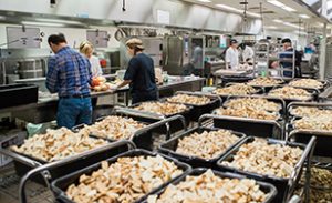 Volunteers prepare Thanksgiving meal.