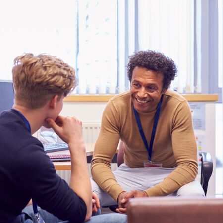 Photo of an admissions counselor chatting with a student about transferring to St. Scholastica