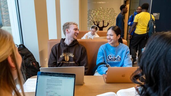 Students gathered at a table in the St. Scholastica Student Center.