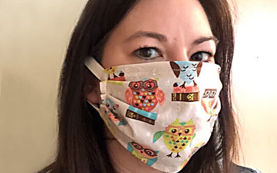 Amy Lyttle wearing one of the masks she's sewing for the healthcare crisis