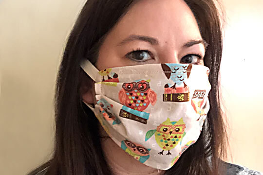 Amy Lyttle wearing one of the masks she's sewing for the healthcare crisis