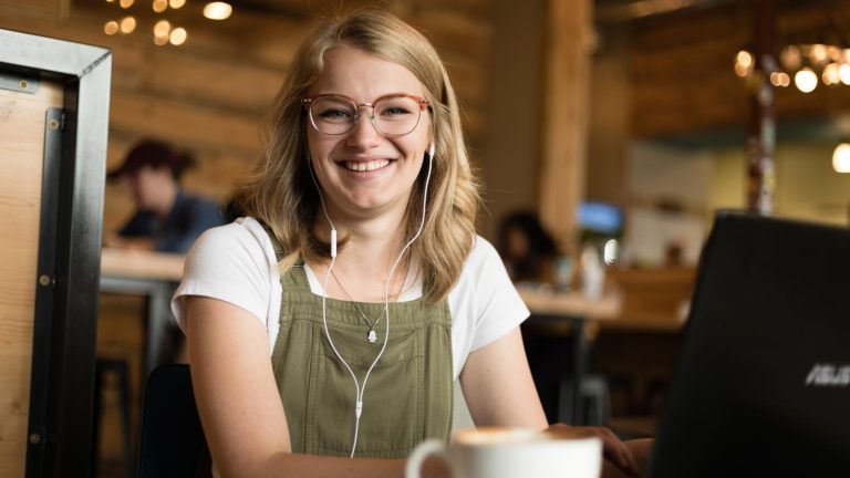 Student studying in a coffee shop.