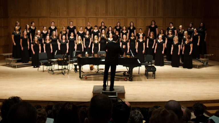 St. Scholastica Choir presenting in the Mitchell Auditorium.