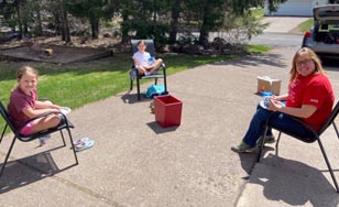 Cindy Miller having lunch with two of her students, Addison Wheeler and Elizabeth Norton.