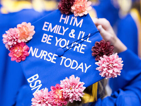 A back view of a St. Scholastica nursing graduate's graduation cap.