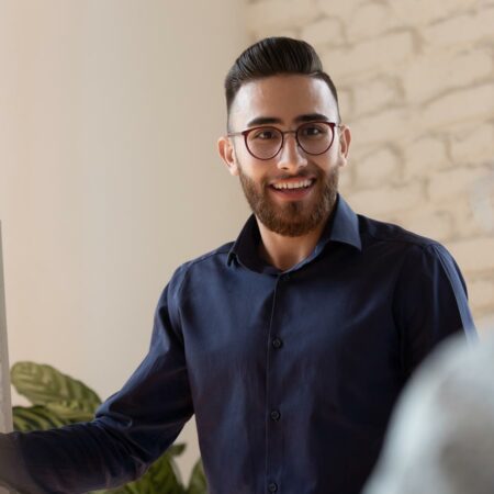 Conference presenter in front of an audience.