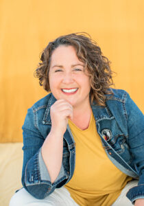 Diana Oestreich headshot. Yellow background.