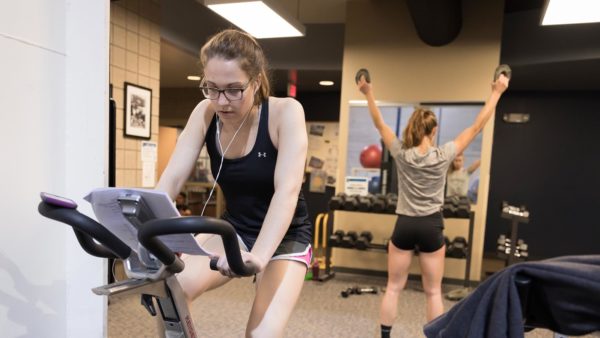 Students working out in St. Scholastica's Burns Wellness Commons fitness center.