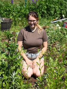 Phot of Mikayla Eldredge working in the garden