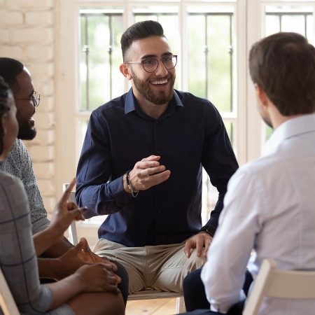 Group of people meeting and having a discussion.