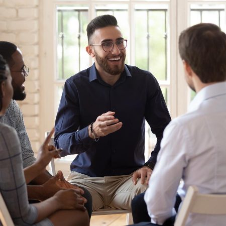 Group of people meeting and having a discussion.