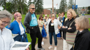 Several alumni gather for a group tour of St. Scholastica.