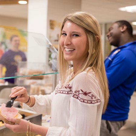 St. Scholastica students getting food in Greenview Dining Room.