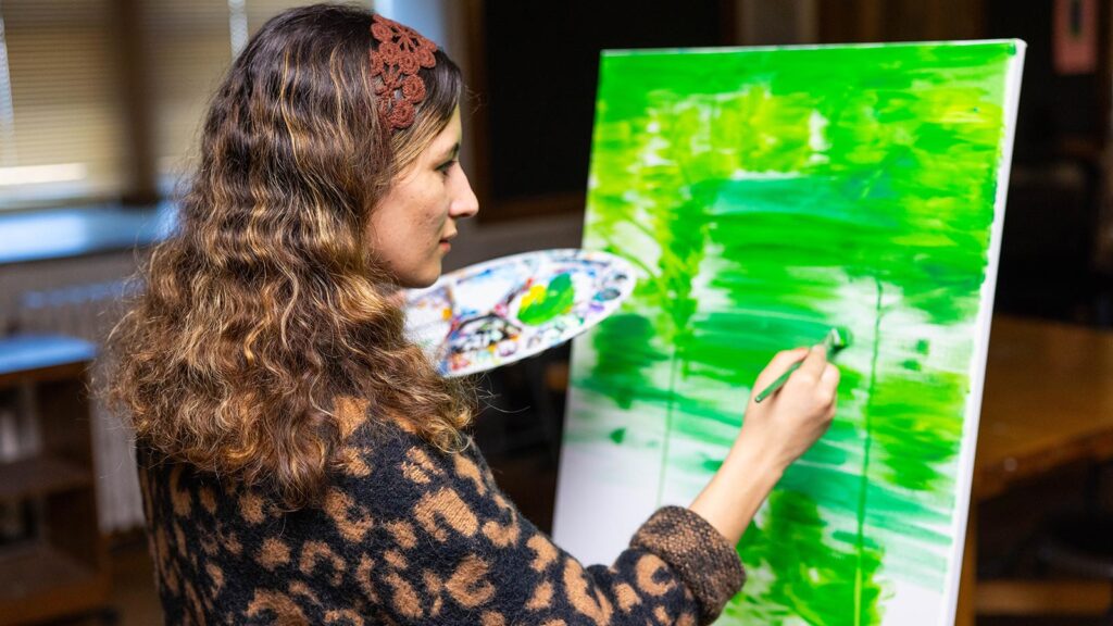St. Scholastica student Halima Amiri painting.
