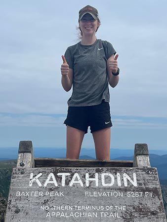 Summit picture on top of Katahdin signifying the completion of Cornwell's thru-hike.