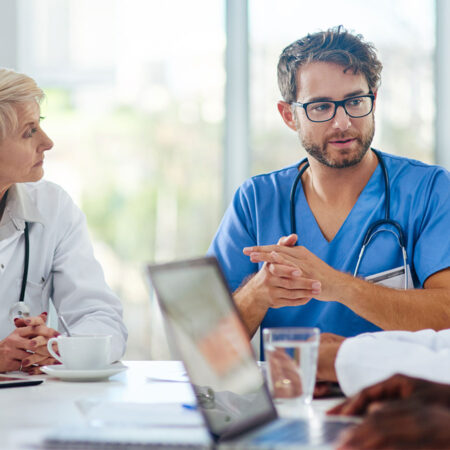 Group of health professionals having a meeting in a conference room.