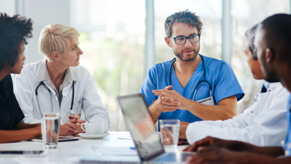 Group of health professionals having a meeting in a conference room.