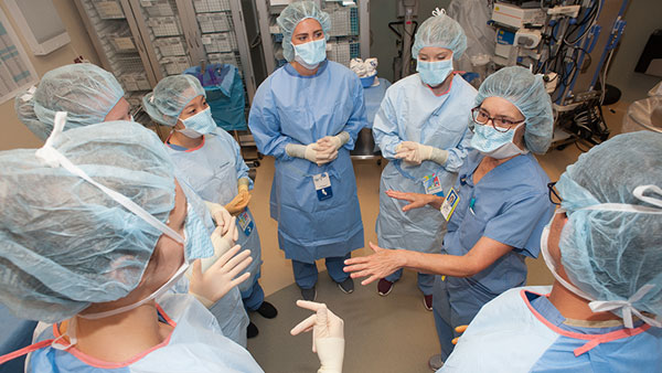 St. Scholastica PA Medicine students working in a surgical setting.