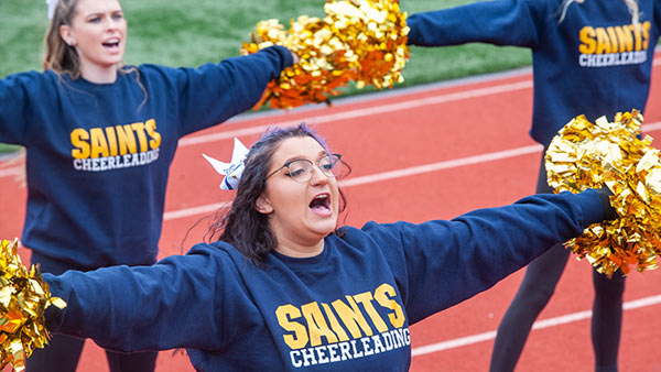St. Scholastica cheerleaders at the homecoming football game.