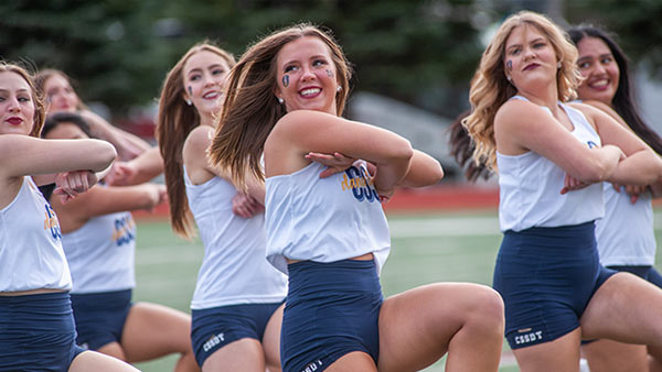 St. Scholastica dance team performing during homecoming.