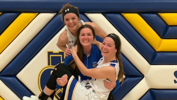 Huber sisters together in the Reif Gym.