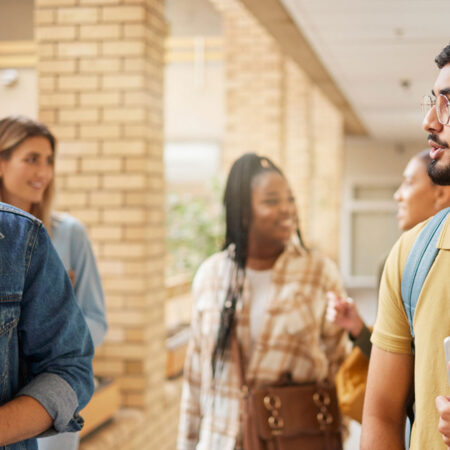 International students walking on a campus.