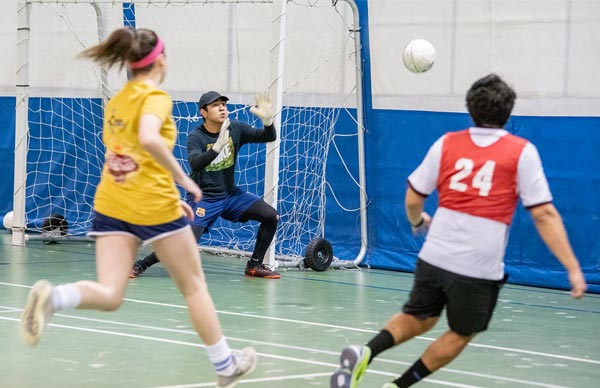 Students participating in soccer intramurals in the Burns Wellness Commons at St. Scholastica.